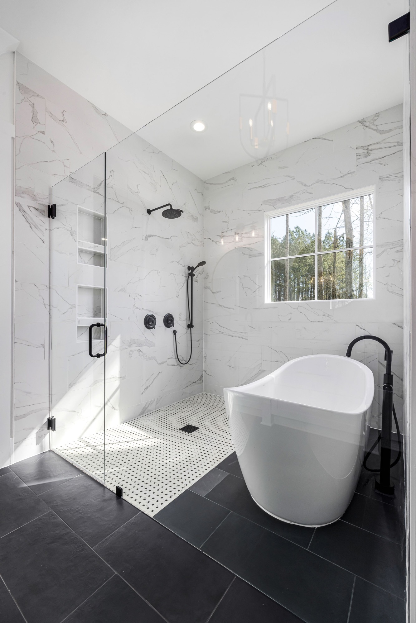 A modern bathroom with walk-in shower and bath