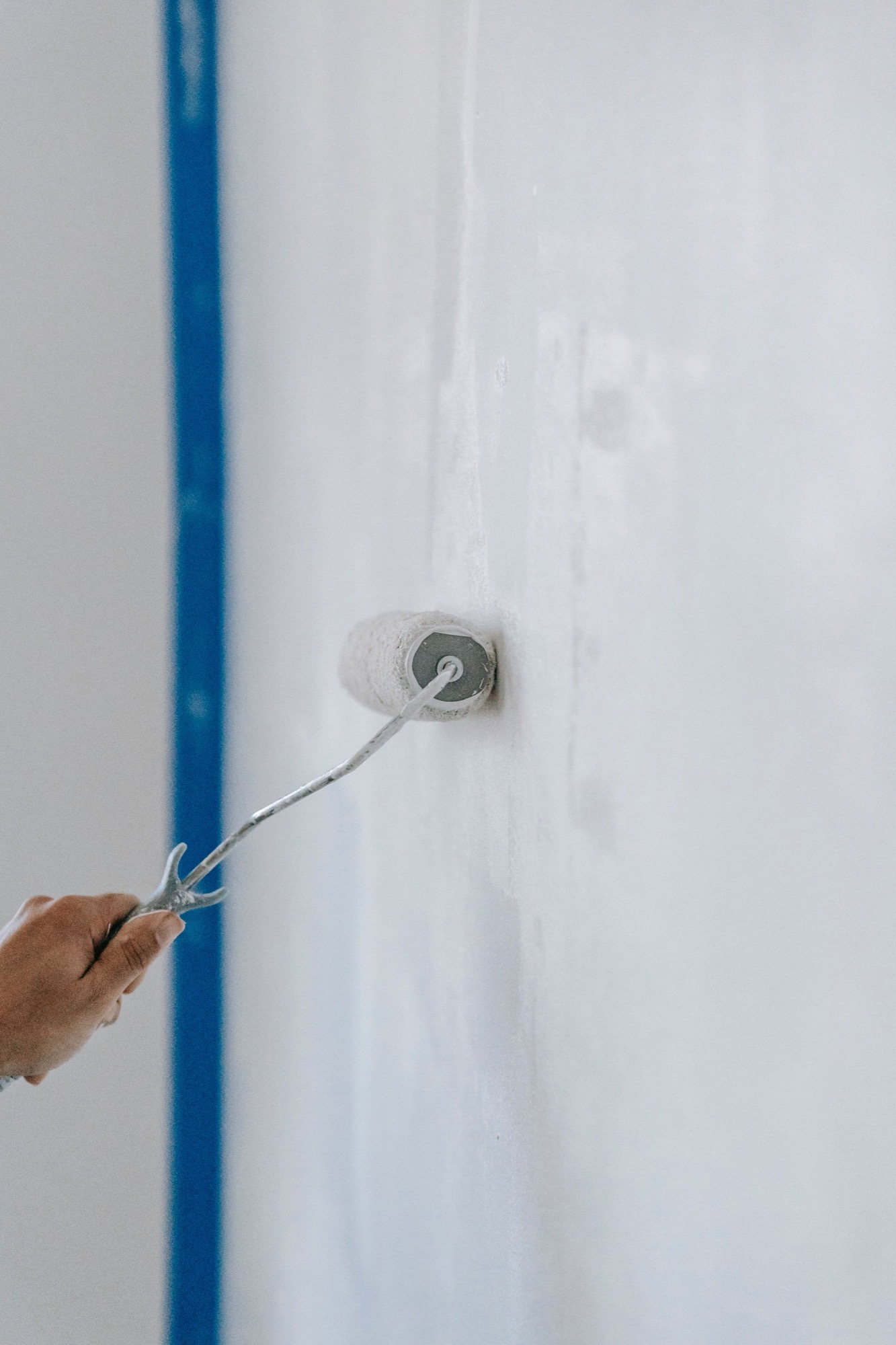 Fresh paint being applied to a wall